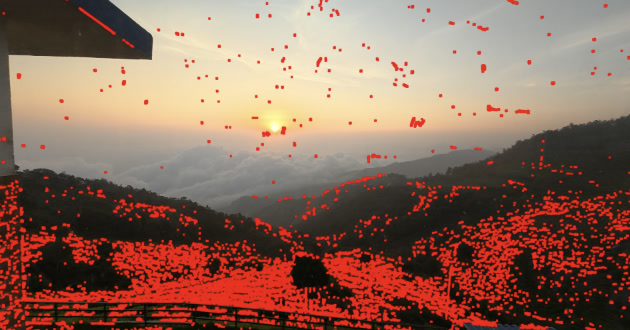 Early red detection mask covering sky spots but also incorrectly selecting the roof, hills and tea bushes